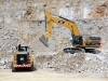 CAT large wheel loader and large excavator. Hillhead quarry face demo area