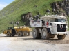 Komatsu articulated truck and Terex mining truck, rock processing demo area. Hillhead.